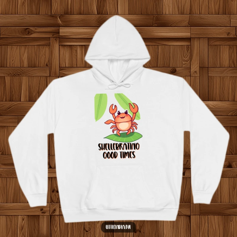 Funny, delighted crab performing a flamboyant dance on a banana leaf, printed on a soft, warm hoodie.