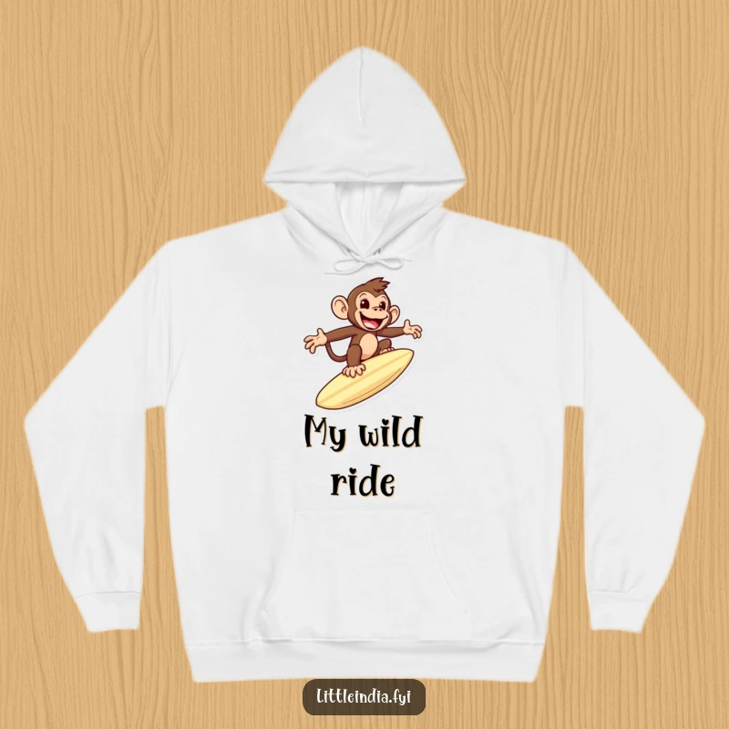 Funny hoodie design featuring a mischievous monkey riding a giant roti like a surfboard, offering warmth and playful humor.